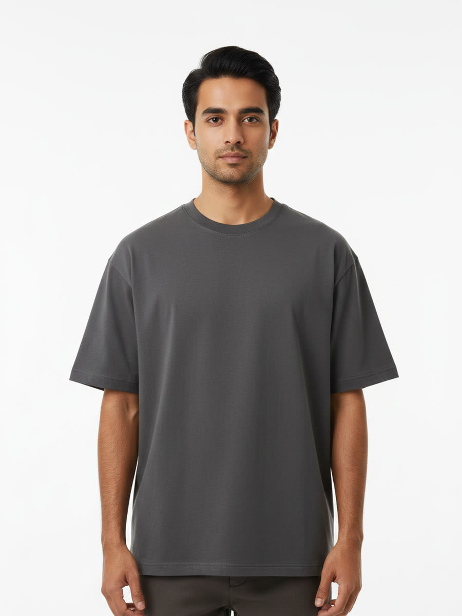 Foldinn drop shoulder tee in Charcoal, worn by a model