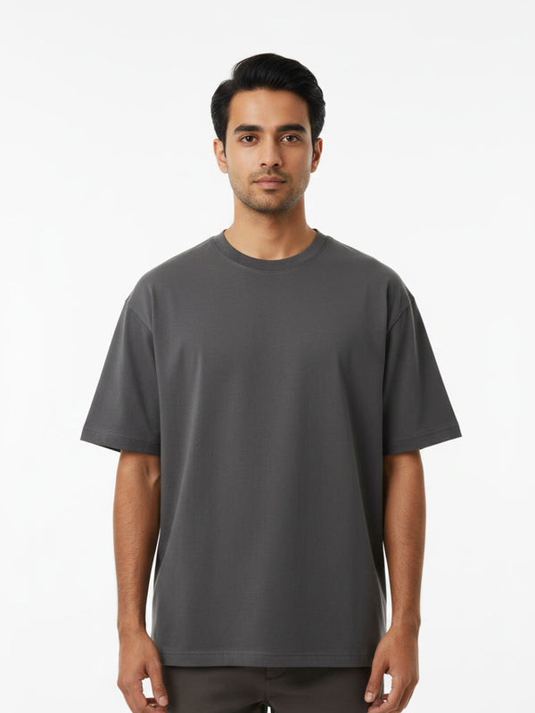 Foldinn drop shoulder tee in Charcoal, worn by a model
