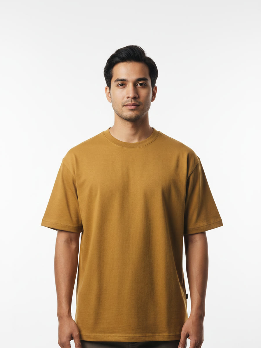 Foldinn drop shoulder tee in Mustard, worn by a model