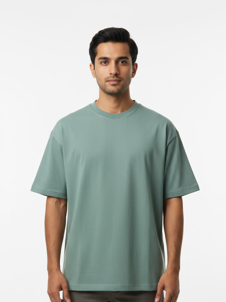 Foldinn drop shoulder tee in Sage Green, worn by a model
