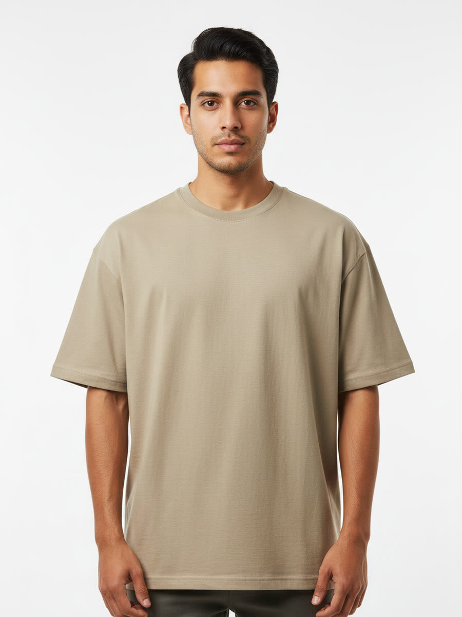 Foldinn drop shoulder tee in Sand, worn by a model